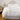 st geneve salzburg duvet on bed beside chair with books stacked on it