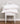 two st geneve salzburg pillows stacked on white chair