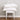 two st geneve salzburg pillows stacked on white chair